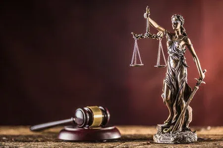 Lady Justice statue and gavel